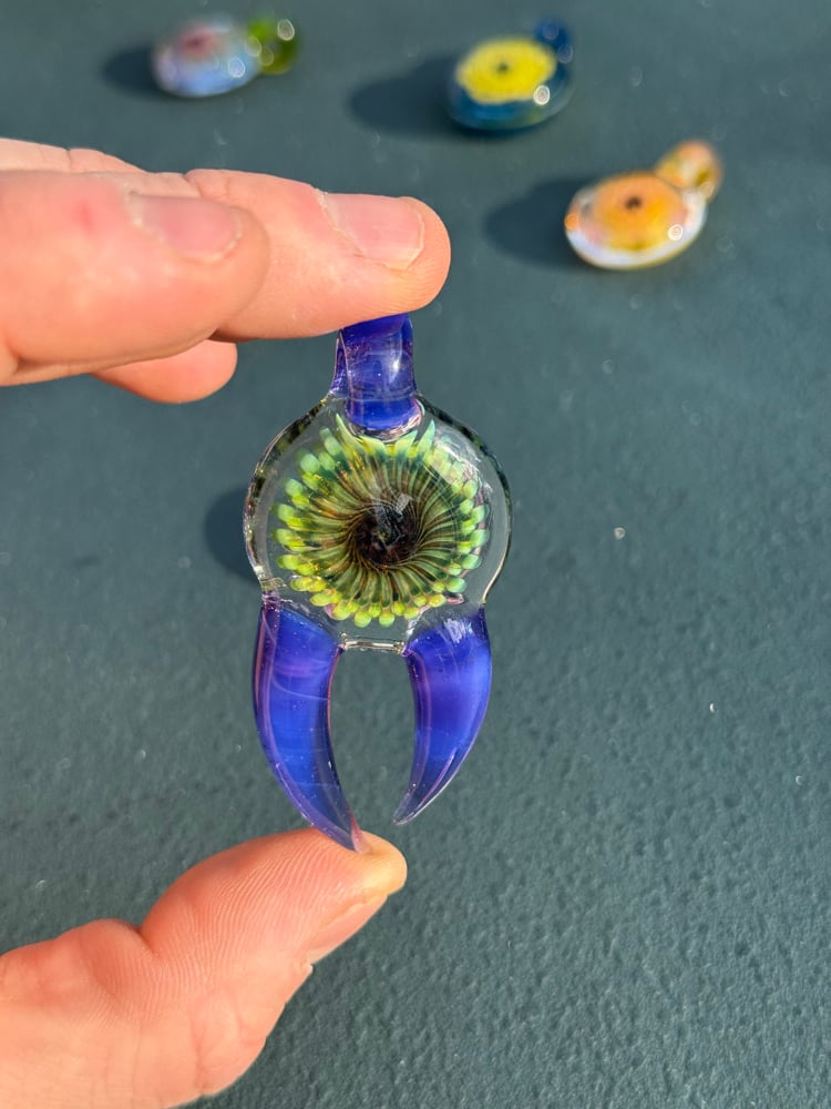Image of  Green and purple horned pendant
