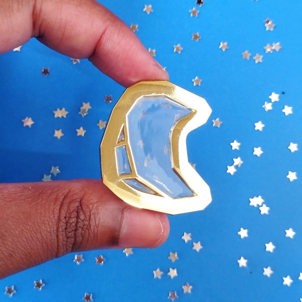 Image of glass moon enamel pin