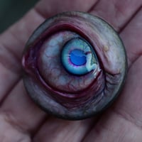 Image 8 of Custom Swappable Phone Grip for smartphones, bright blue reflective pupil, glow in the dark 