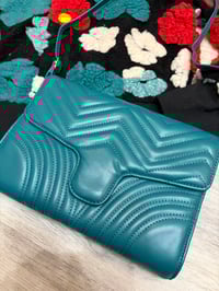 Image 2 of Teal crossbody handbag can be worn as a clutch also