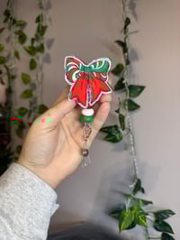 Green and red swirl bow 