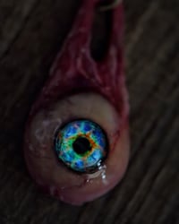 Image 6 of Optic Nerve-glow in the dark eye pendant with “eye shine” pupil