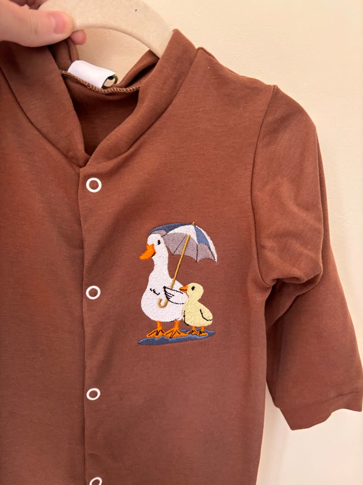 Image of Brown baby grow 12-18