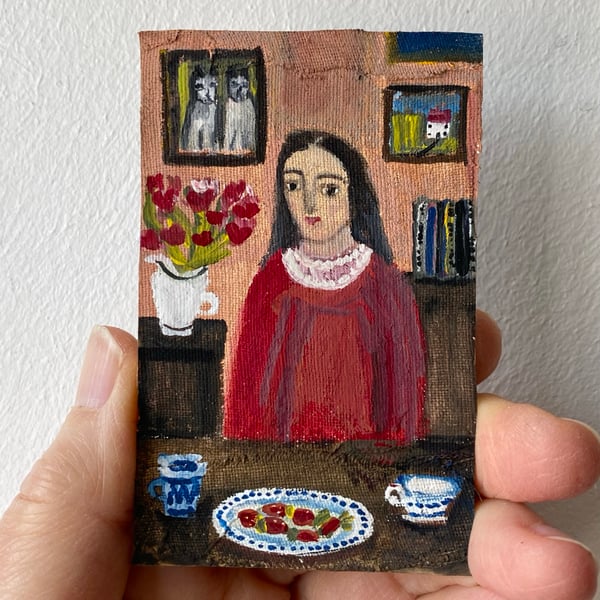 Image of woman at a table with strawberries 