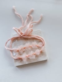 Image 1 of blush bow tieback