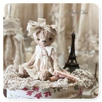 Image 1 of Handmade beige teddy bear wearing a pretty floral dress.