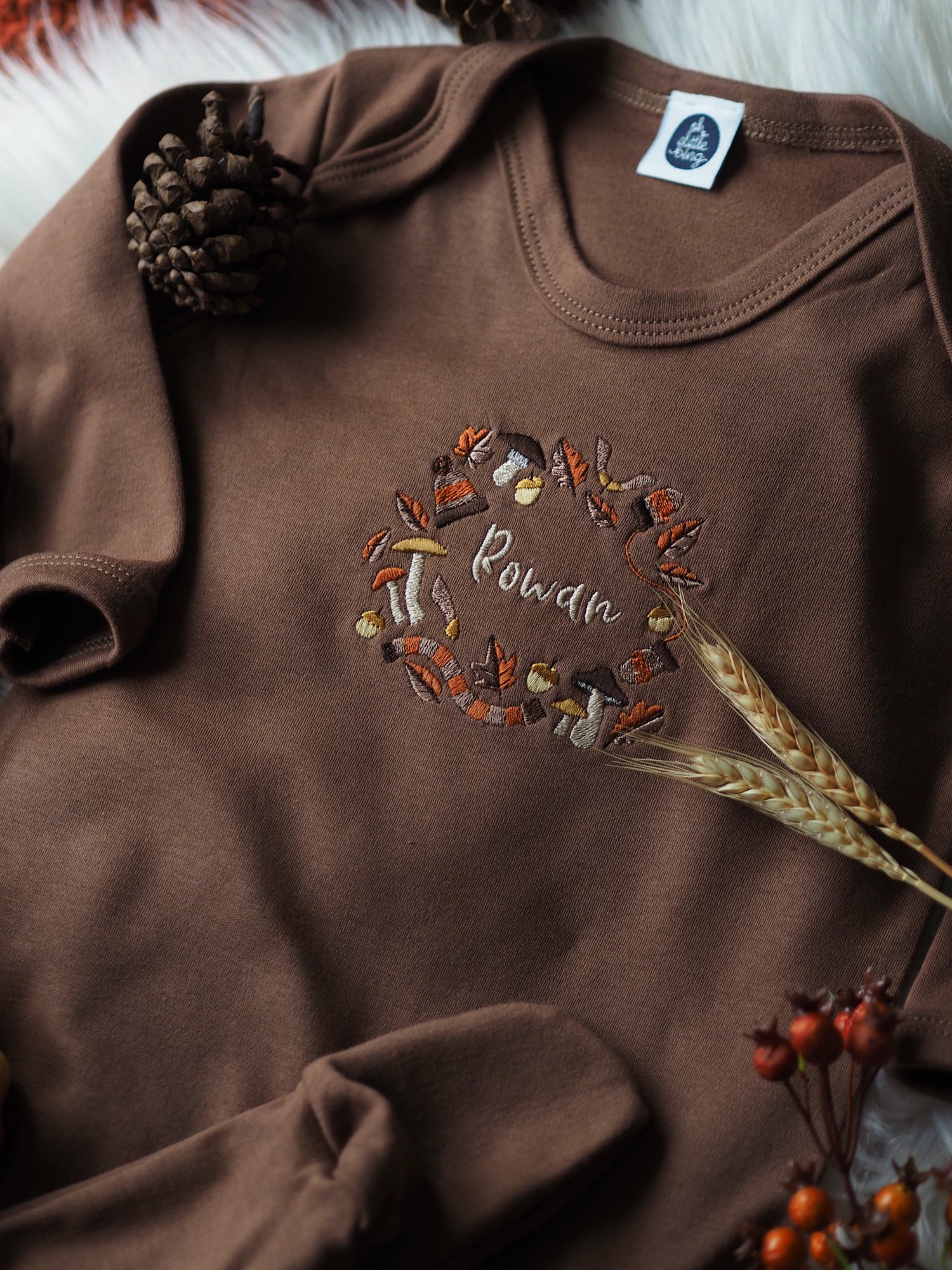 Image of A Rustling Stroll - Cinnamon sleepsuit