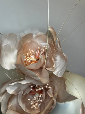 Image of Pale pink silk flower headpiece.