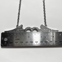 Image 4 of musical angel brass knuckle necklace *clear*