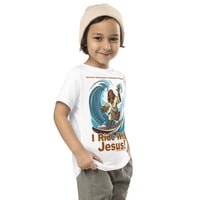 Image 1 of I Ride With Jesus Surfing Toddler Short Sleeve Tee