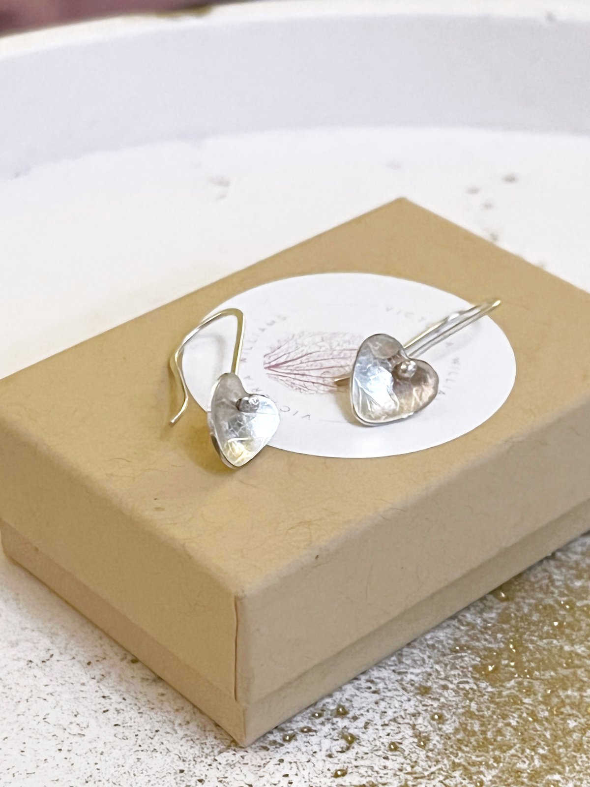 Image of Recycled sterling silver heart drop earrings.