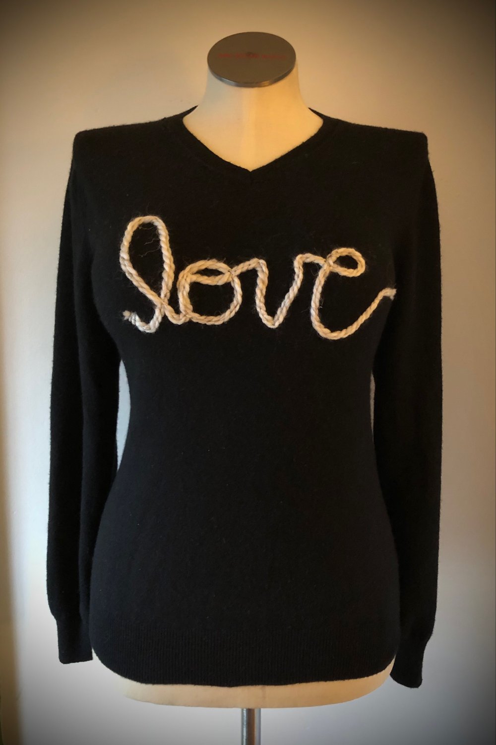 Upcycled “love” cursive yarn sweater in black