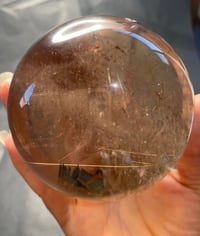 Image 21 of Golden Rutile In Smoky Quartz Sphere #1771