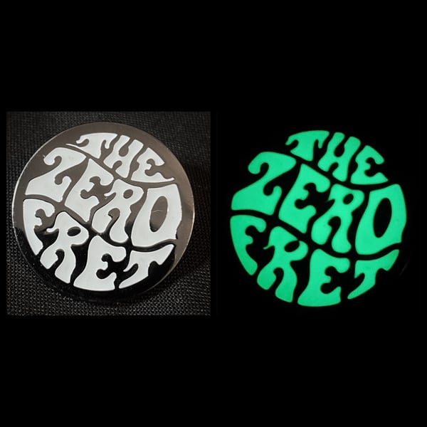 Image of TZF glow in the dark black nickel plated enamel pin badge