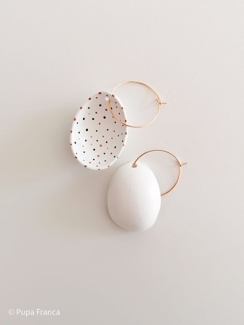 Image of Eggshell Earrings with Black and Golden dots 