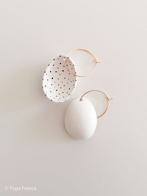 Image of Eggshell Earrings with Black and Golden dots