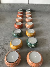 Multi coloured tea light holder