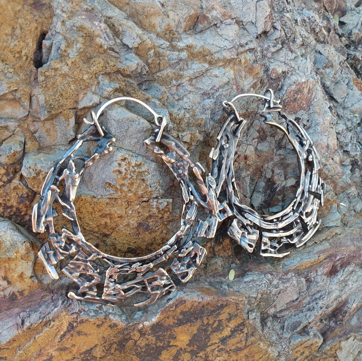 Image of 2 1/2" bronze 'kharybdis'  hoop earrings