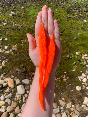 orange worm earrings