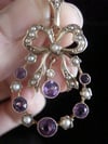 Antique Edwardian 9ct yellow gold amethyst seed pearl bow pendant