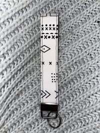 white with black tribal key fob wristlet