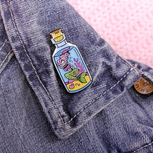 Image of Undead Mermaid in a Bottle enamel pin - skeleton - creepy cute - pastel goth - lapel pin badge