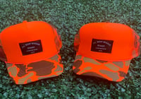 Image 1 of “701” Collection Orange Camo Trucker Hat