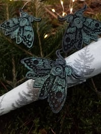 Image 1 of Gothic moth napkin rings