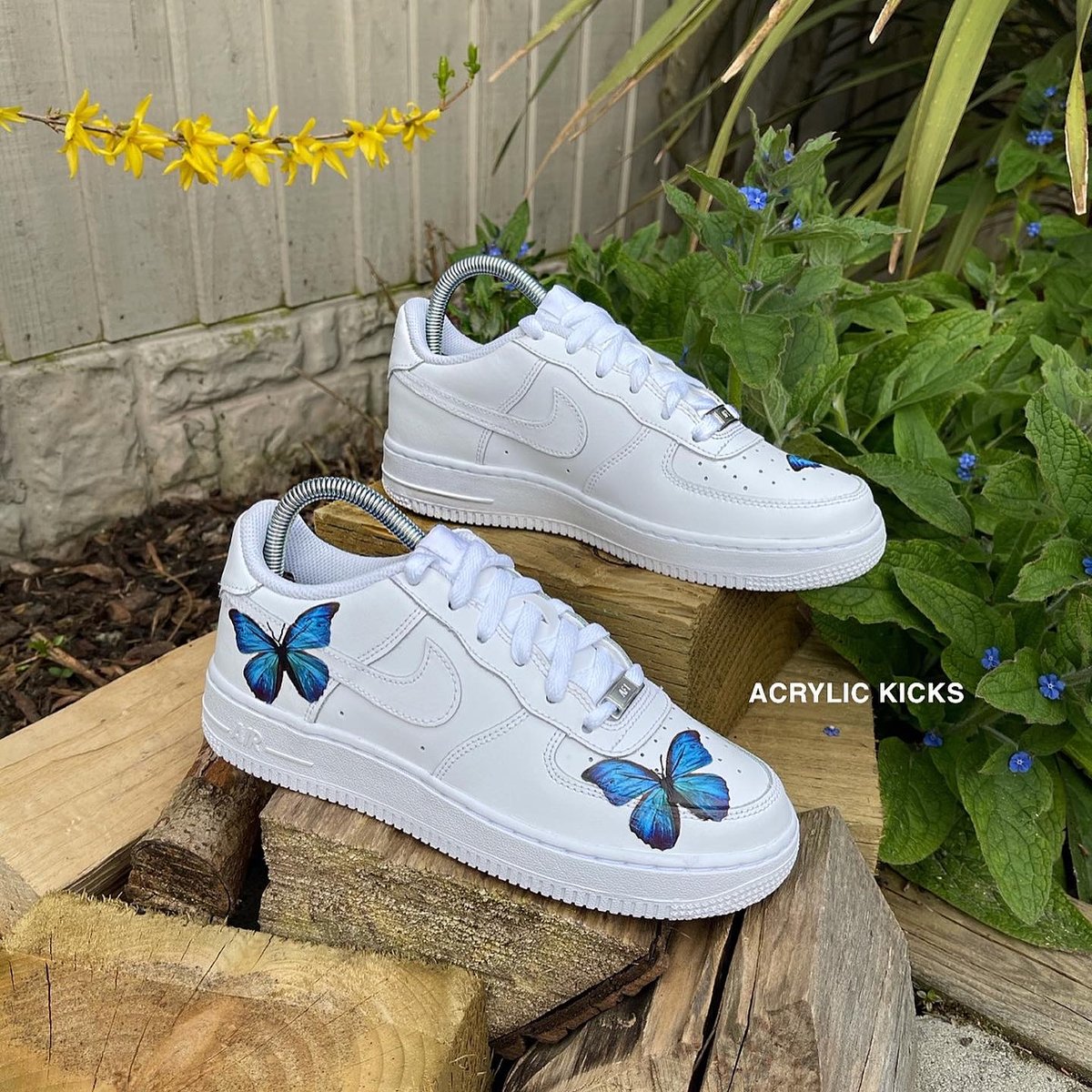 white nike with blue butterfly