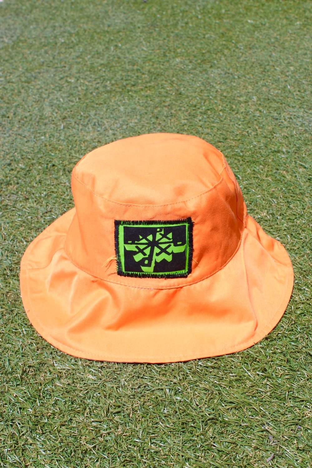 just the right spots bucket hat in orange 