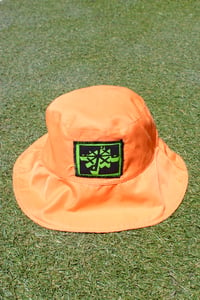 Image of just the right spots bucket hat in orange 