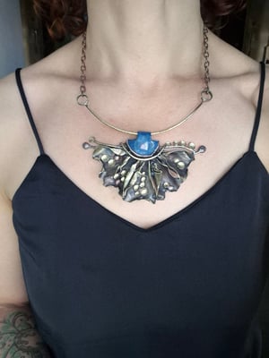 Blue stone and bullet cussings necklace 