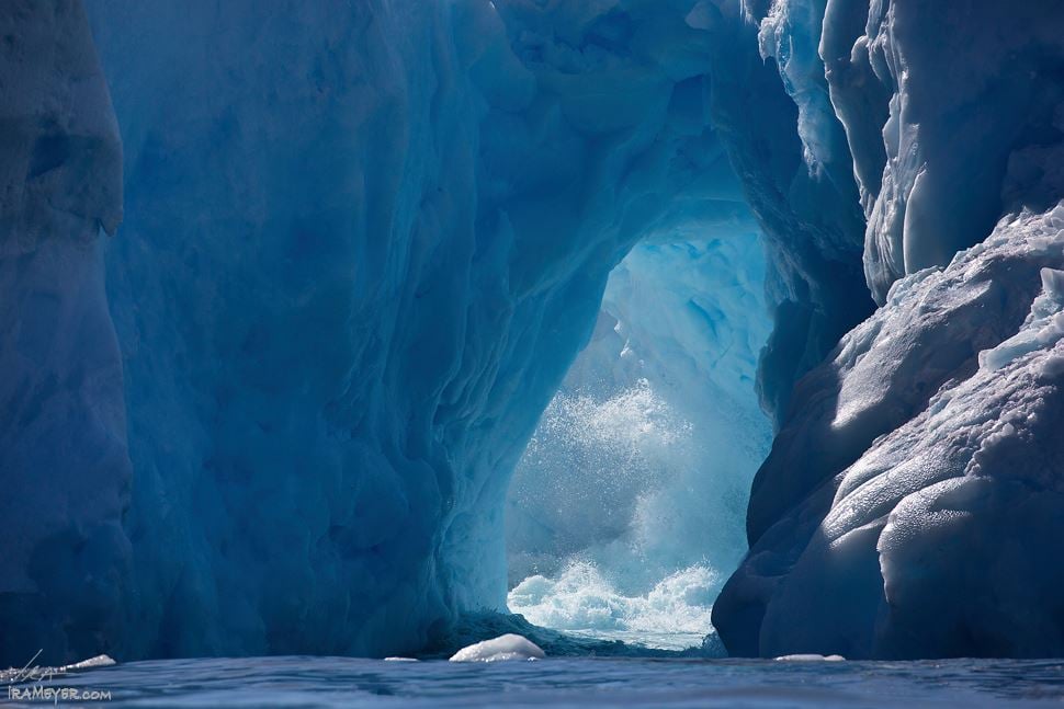 Crashing Wave Through Iceberg Arch | Ira Meyer Photography