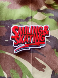 Image 1 of Smiling & Skating