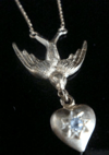 Edwardian 18ct diamond swallow heart necklace