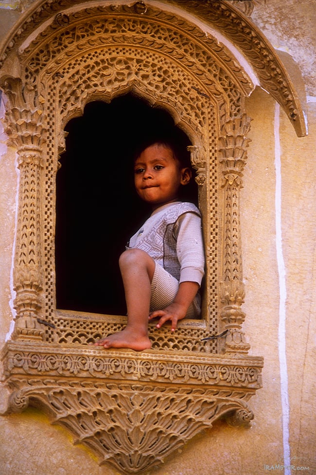 Boy in Ornate Window