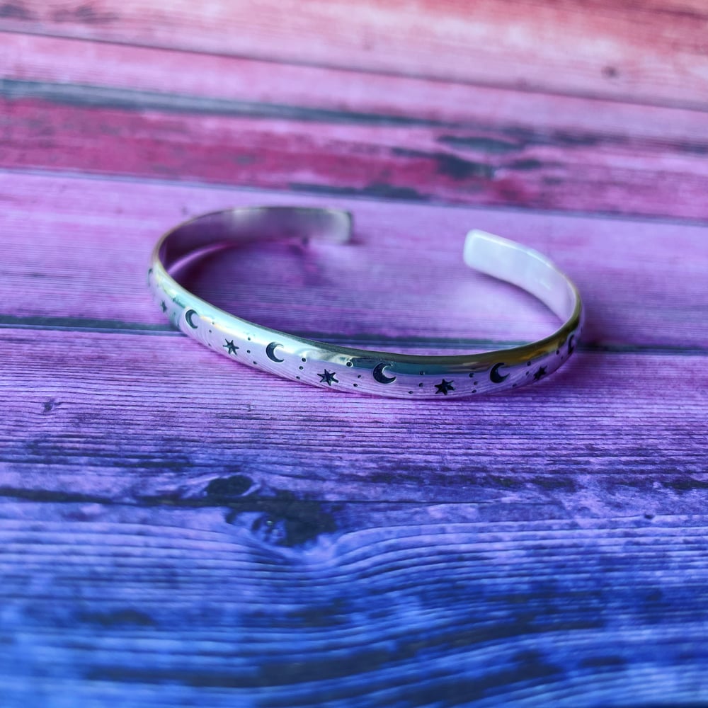 Image of Star and Moon silver stamped cuff bracelet. Heavy celestial sterling bangle. Chunky cosmic cuff.