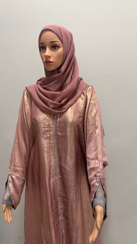 Image 4 of Korean shimmer fabric Flared sleeve abaya rose gold it comes with a matching scarf 