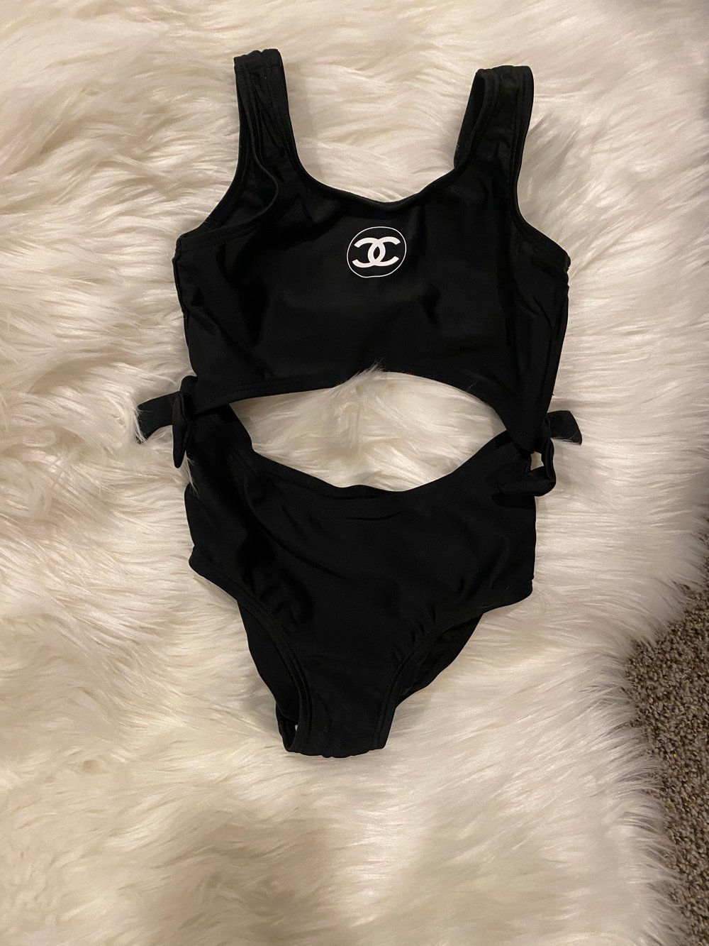 Black one piece cut out Chanel bathing suit
