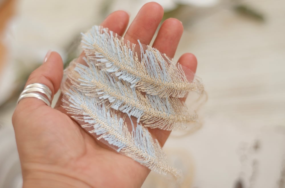 Image of Embroidery feather tieback