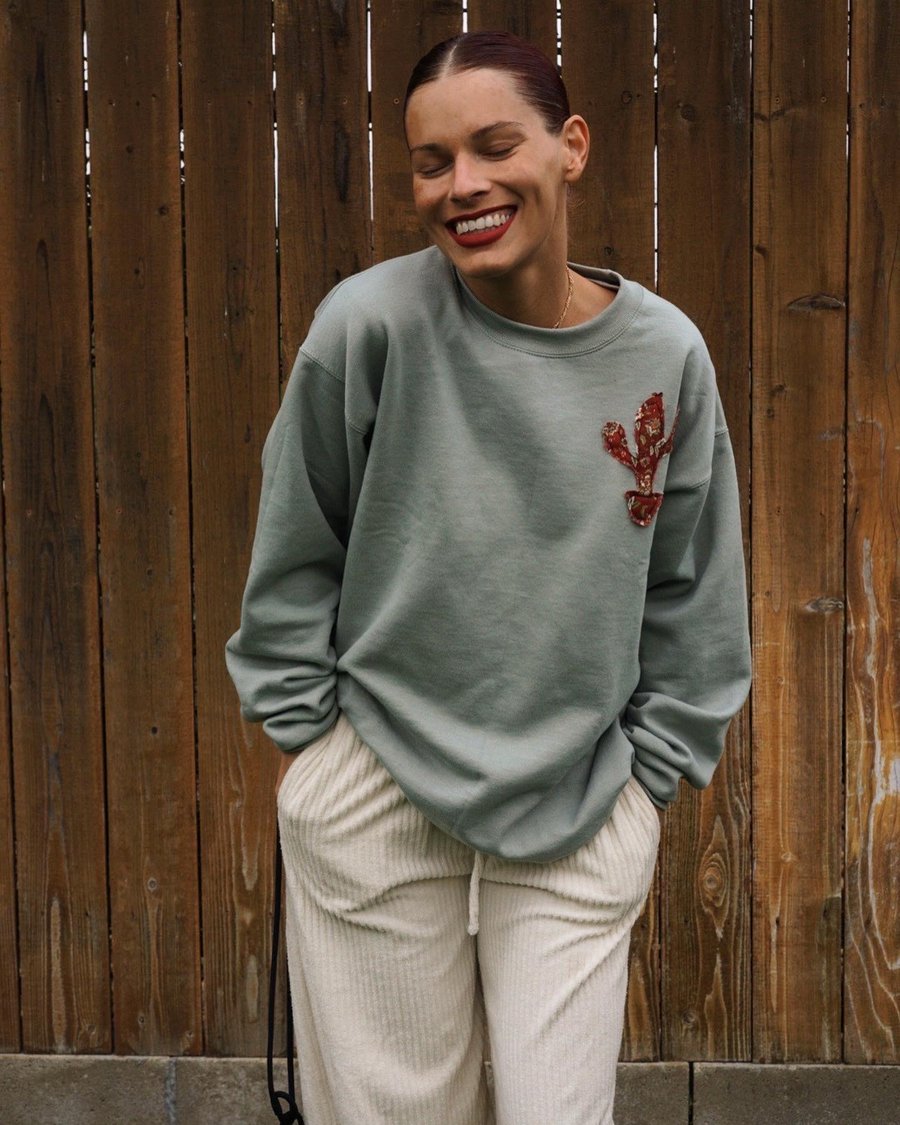 Image of olivine sweatshirt. 