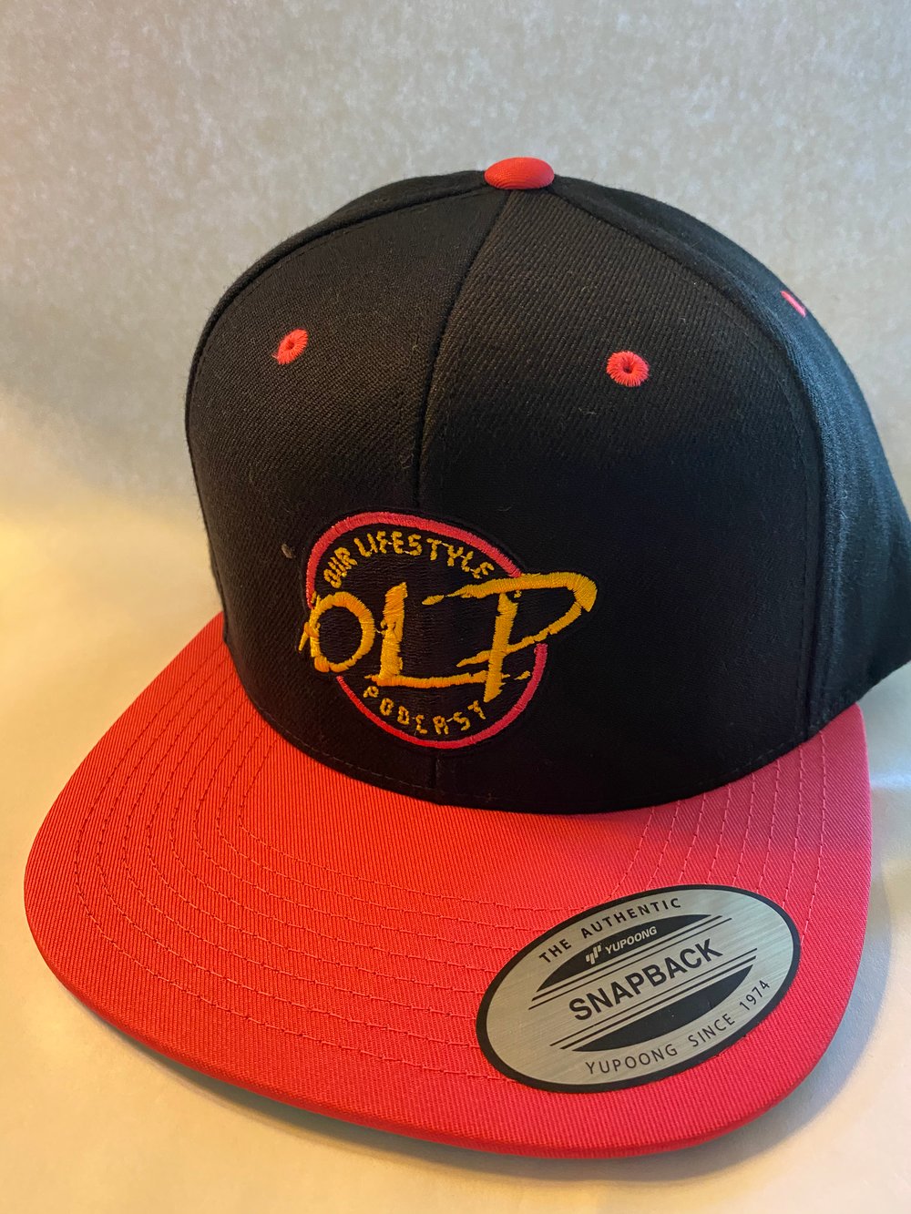 Image of Round OLP Theme Logo SnapBack Hat