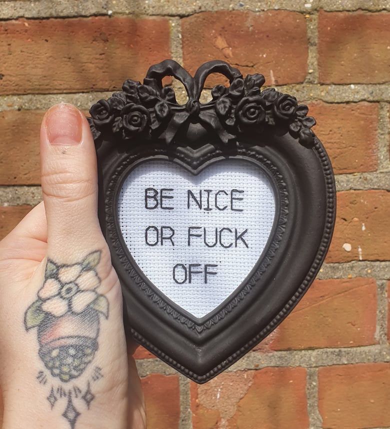 Image of 'Be nice' framed stitch.