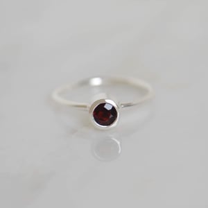 Image of Wine Red Garnet round cut classic silver ring