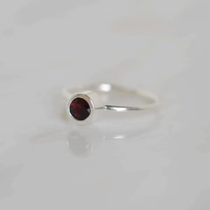 Image of Wine Red Garnet round cut classic silver ring