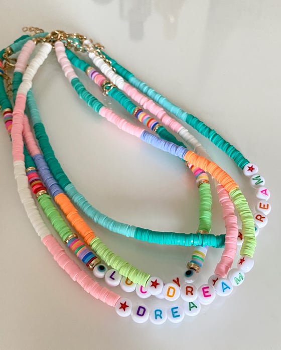 Image of COLLANA CANDY SCRITTE