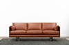 CLOVER COUCH IN TASMANIAN BLACKWOOD WITH SUNDANCE LEATHER