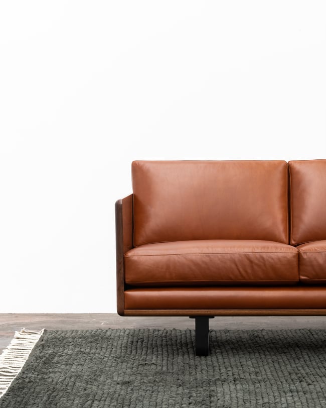 CLOVER COUCH IN TASMANIAN BLACKWOOD WITH SUNDANCE LEATHER