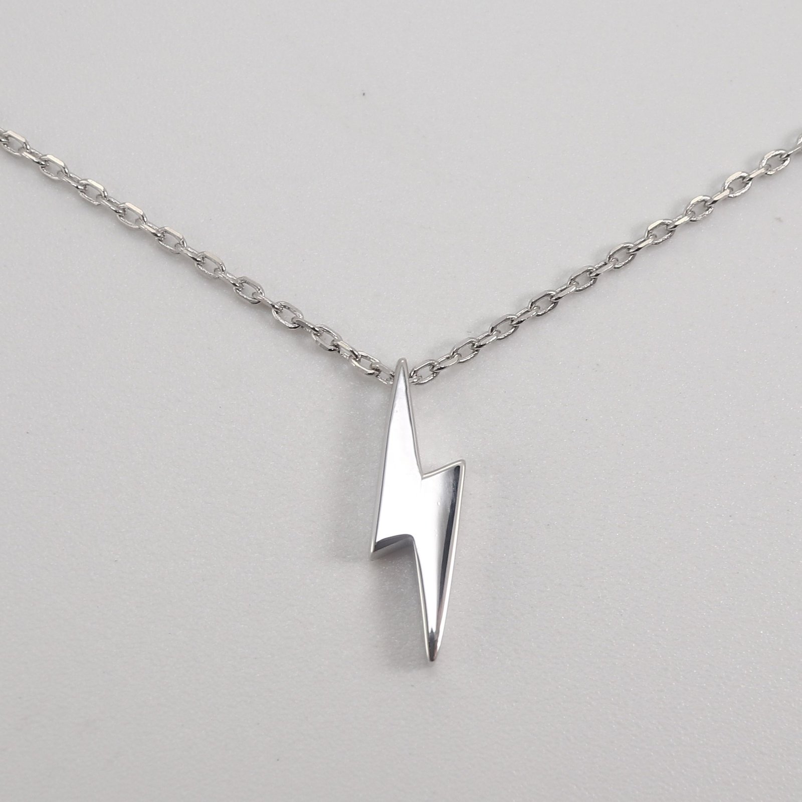 silver lightning bolt charm