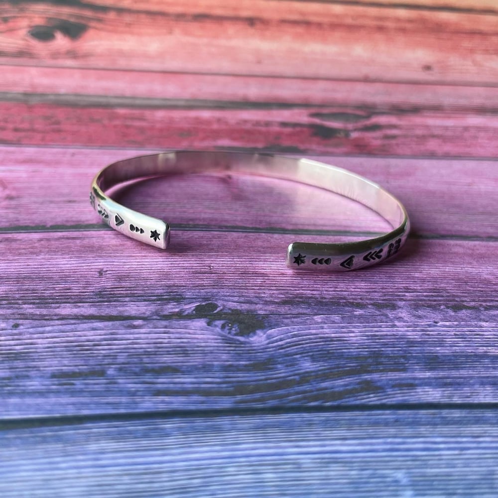 'Luna' symbol stamped cuff bracelet. Slim silver Aztec patterned cuff bracelet.